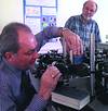 Dr Nikolay Zinovev (left), from St Petersburg, Russia, places a book in the imaging system located in the Institute of Microwave and Photonics, at the University of Leeds, England. Principal researcher Dr Robert Miles looks on